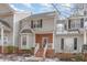 Charming home with brick facade, bay window, and a well-maintained front yard with snowy accents at 2623 Broad Oaks Pl, Raleigh, NC 27603