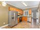 Functional kitchen boasts stainless steel appliances, ample cabinet space, and durable laminate flooring at 2623 Broad Oaks Pl, Raleigh, NC 27603