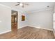 Open-concept living area with hardwood floors and a view into the kitchen at 2623 Broad Oaks Pl, Raleigh, NC 27603