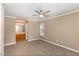 Comfortable main bedroom featuring plush carpet and an en suite bathroom for convenience at 2623 Broad Oaks Pl, Raleigh, NC 27603