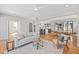 Open-concept living area showcases hardwood floors connecting to the dining and kitchen areas, perfect for entertaining at 309 Taylor St, Raleigh, NC 27607