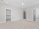 Spacious main bedroom featuring neutral walls, carpet floors, ceiling fan and ensuite bathroom and walk-in closet at 309 Taylor St, Raleigh, NC 27607