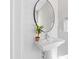 Charming powder room with a pedestal sink, oval mirror, and shiplap wall detail at 309 Taylor St, Raleigh, NC 27607