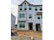 A townhome under construction featuring multiple windows ready for finishing details at 312 Chesapeak Commons St # 144, Garner, NC 27529
