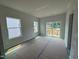Living room with sliding glass doors opening to wooden deck at 312 Chesapeak Commons St # 144, Garner, NC 27529
