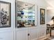 Home bar with sink, mirrored wall, and beautiful glassware at 3206 Sussex Rd, Raleigh, NC 27607