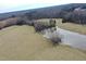 Expansive land with a serene pond, complemented by mature trees, offering a private retreat at 3344 Cobb Farm Trl, Mebane, NC 27302