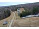 Expansive aerial view of the land with a home, shooting range and a long drive, highlighting its vastness at 3344 Cobb Farm Trl, Mebane, NC 27302
