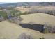 Breathtaking aerial perspective of the estate with ponds and diverse natural landscapes at 3344 Cobb Farm Trl, Mebane, NC 27302
