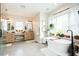 Bright bathroom featuring double sinks, soaking tub, and plenty of natural light from the large window at 3344 Cobb Farm Trl, Mebane, NC 27302