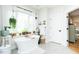 Bright bathroom featuring a freestanding tub, large windows, and neutral color palette at 3344 Cobb Farm Trl, Mebane, NC 27302