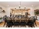Spacious dining room showcases an oversized wooden table with seating for ten and an open view to the adjacent kitchen at 3344 Cobb Farm Trl, Mebane, NC 27302