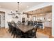 Large dining table with seating, set in between the kitchen and Gathering room, offers an open concept living space at 3344 Cobb Farm Trl, Mebane, NC 27302