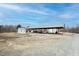 Spacious metal outbuilding or shelter perfect for equipment storage with ample surrounding land at 3344 Cobb Farm Trl, Mebane, NC 27302