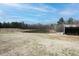 Scenic view of a tranquil pond surrounded by trees and open field with barn at 3344 Cobb Farm Trl, Mebane, NC 27302