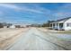 Wide shot of the property featuring multiple structures and a long, private driveway at 3344 Cobb Farm Trl, Mebane, NC 27302