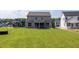 Expansive backyard featuring a screened porch and lush green lawn, perfect for outdoor enjoyment and relaxation at 3521 Amelia Grace Dr # 67, Fuquay Varina, NC 27526