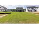 Expansive backyard of a home featuring lush green lawn, showcasing outdoor space for relaxation and recreation at 3521 Amelia Grace Dr # 67, Fuquay Varina, NC 27526
