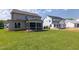 Spacious backyard featuring a screened porch and well-manicured lawn at 3521 Amelia Grace Dr # 67, Fuquay Varina, NC 27526