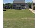 Expansive backyard featuring a well-maintained lawn and a covered patio at 3521 Amelia Grace Dr # 67, Fuquay Varina, NC 27526