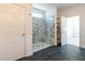 Modern bathroom featuring a glass-enclosed shower with marble tile and built-in shelves at 3521 Amelia Grace Dr # 67, Fuquay Varina, NC 27526
