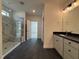 Modern bathroom boasts a glass enclosed shower and double sink vanity at 3521 Amelia Grace Dr # 67, Fuquay Varina, NC 27526