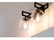 The bathroom features unique glass globe vanity lights, offering a stylish aesthetic touch at 3521 Amelia Grace Dr # 67, Fuquay Varina, NC 27526