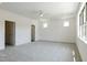 Spacious bedroom with neutral carpeting, a ceiling fan, recessed lights and plenty of natural light at 3521 Amelia Grace Dr # 67, Fuquay Varina, NC 27526