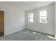 Bedroom features neutral paint, new carpet, and two windows at 3521 Amelia Grace Dr # 67, Fuquay Varina, NC 27526