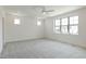 Bright bedroom with neutral carpeting, large windows, and recessed lighting at 3521 Amelia Grace Dr # 67, Fuquay Varina, NC 27526