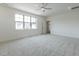 Bright, carpeted bedroom with a ceiling fan, neutral paint, and plenty of natural light at 3521 Amelia Grace Dr # 67, Fuquay Varina, NC 27526