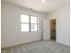 Bright bedroom with large window and closet/storage space creating a cozy, clutter-free ambiance at 3521 Amelia Grace Dr # 67, Fuquay Varina, NC 27526
