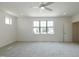 Large bright bedroom with neutral carpeting and large windows for natural light at 3521 Amelia Grace Dr # 67, Fuquay Varina, NC 27526