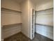 Walk-in closet with rods and shelves for organized storage at 3521 Amelia Grace Dr # 67, Fuquay Varina, NC 27526