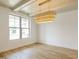 Light and airy dining room with wood floors, stylish lighting, and large window at 3521 Amelia Grace Dr # 67, Fuquay Varina, NC 27526