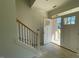 Unfinished entryway with a staircase and Craftsman-style front door at 3521 Amelia Grace Dr # 67, Fuquay Varina, NC 27526