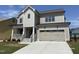 Beautiful two-story home featuring a welcoming porch, stone accents, and a spacious two-car garage at 3521 Amelia Grace Dr # 67, Fuquay Varina, NC 27526