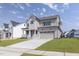 Desirable two-story home with a well-manicured lawn and an attached two-car garage at 3521 Amelia Grace Dr # 67, Fuquay Varina, NC 27526