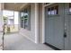 Cozy front porch with stylish door and gray shutters, perfect for relaxing outdoors at 3521 Amelia Grace Dr # 67, Fuquay Varina, NC 27526