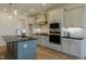 Well-equipped kitchen boasts stainless appliances, custom cabinets, and stylish countertops at 3521 Amelia Grace Dr # 67, Fuquay Varina, NC 27526