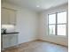 Bright kitchenette with cabinets and a large window at 3521 Amelia Grace Dr # 67, Fuquay Varina, NC 27526