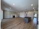 Open-concept living space with a cozy fireplace, elegant decor, and seamless transition to the modern kitchen at 3521 Amelia Grace Dr # 67, Fuquay Varina, NC 27526