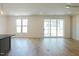Open-concept living room featuring recessed lighting and sliding glass doors at 3521 Amelia Grace Dr # 67, Fuquay Varina, NC 27526