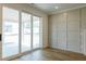Bright living room featuring sliding glass doors and accent wall at 3521 Amelia Grace Dr # 67, Fuquay Varina, NC 27526