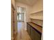 Pantry featuring hardwood floors and storage cabinets with a butcher block countertop at 3521 Amelia Grace Dr # 67, Fuquay Varina, NC 27526