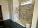 Unfinished shower featuring marble tile, built-in shelving, and a bench at 3521 Amelia Grace Dr # 67, Fuquay Varina, NC 27526