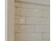 Close up of white brick tiles with light grout in a renovated home at 3521 Amelia Grace Dr # 67, Fuquay Varina, NC 27526