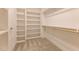 Spacious walk-in closet offers ample storage with built-in shelving and hanging rods at 3521 Amelia Grace Dr # 67, Fuquay Varina, NC 27526