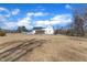 Backyard view of the exterior elevation, in-ground pool, and screened-in porch at 3608 Buzzard Rd, Wendell, NC 27591
