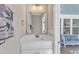 Bathroom features a vanity with a white countertop and stylish mirror at 3608 Buzzard Rd, Wendell, NC 27591